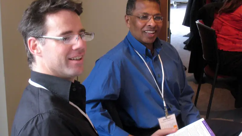 Two colleagues discussing ideas together during a planning workshop